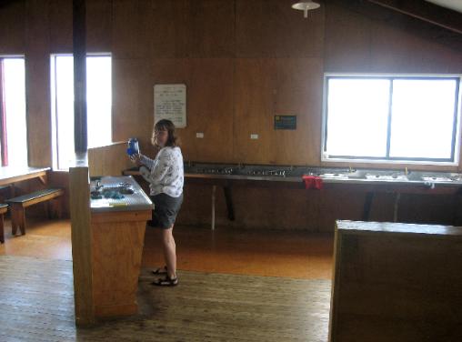 Robin checking out the kitchen with its multiple gas burners and sinks