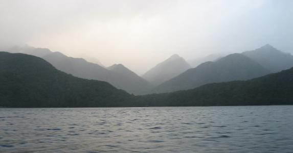 Layers of shadowy blue mountains in the raw Fjordlands wilderness